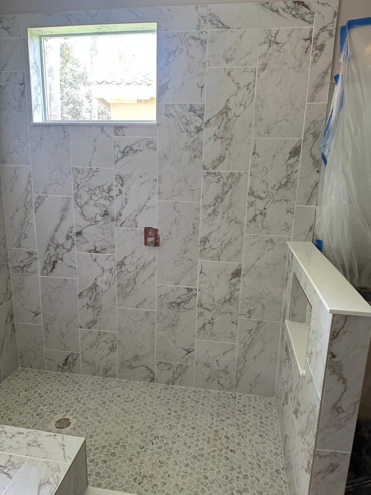 Calacatta shower with a built-in bench